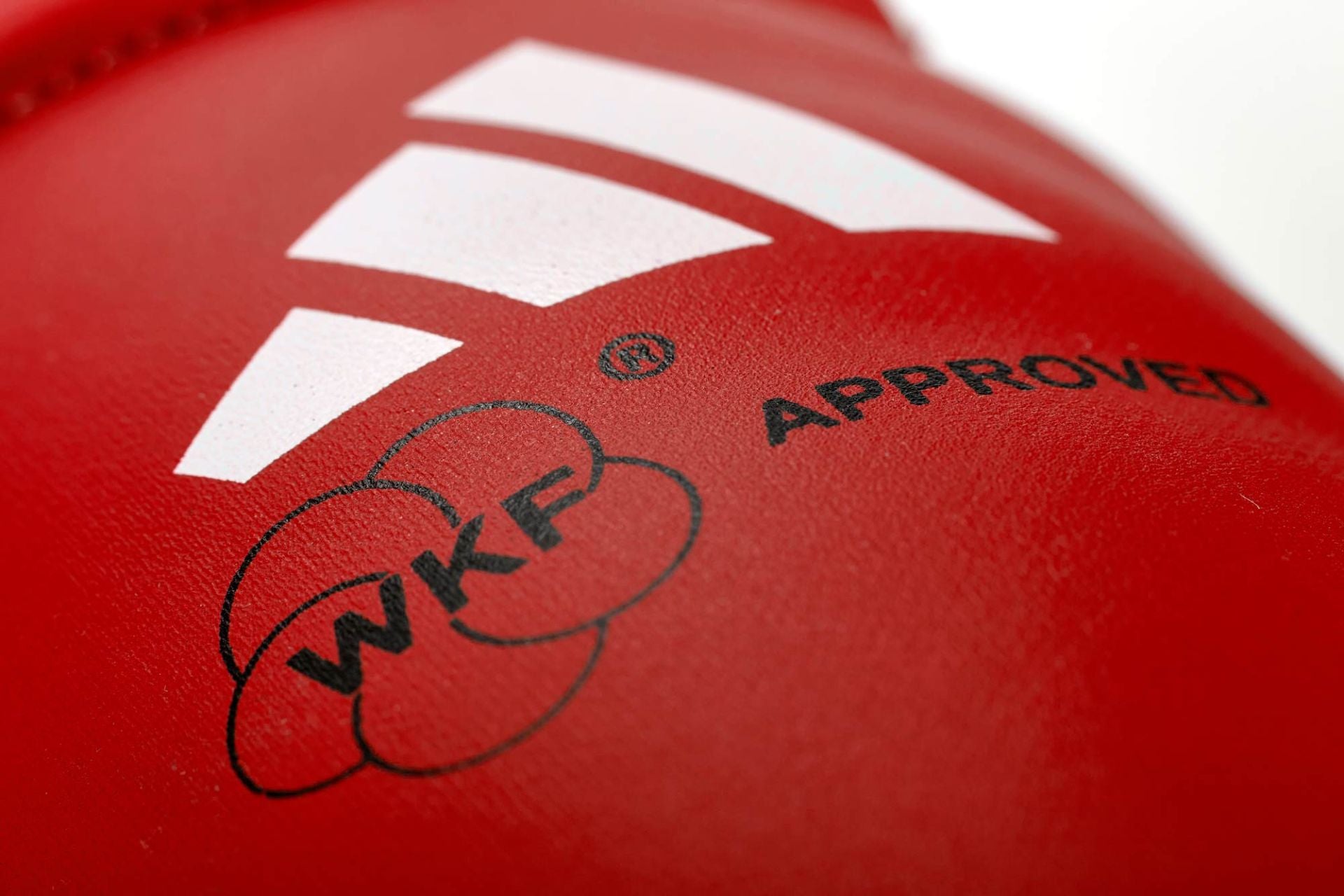 Adidas WKF-approved instep guards, red